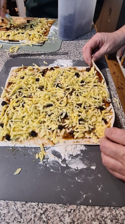 Close up of pizza being made